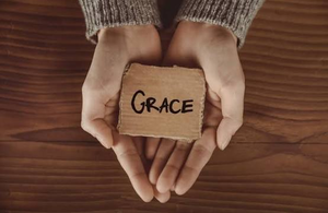 receiving grace, hands open and extended